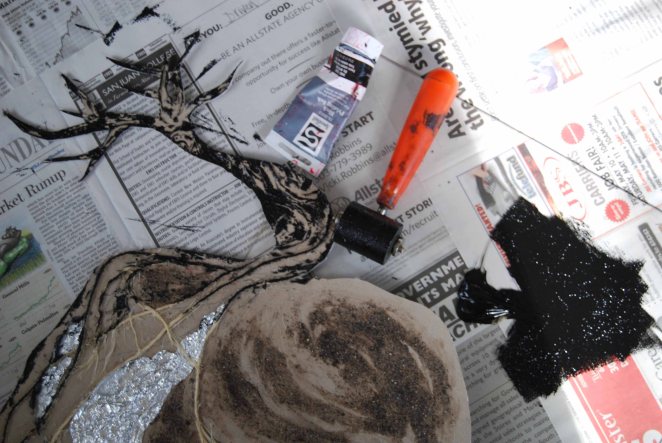 Next, I rolled oil-based printmaking ink over the surface.